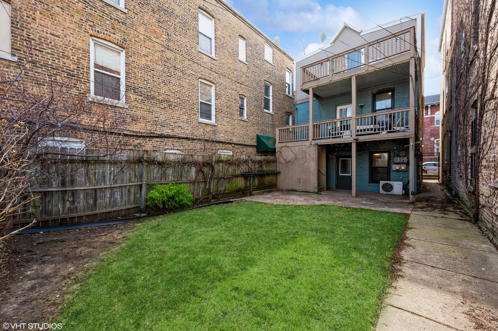 2116 West Lyndale Street, Unit 1 Chicago, IL 60647 - Photo 13 of 16 a view of an house with backyard and a garden
