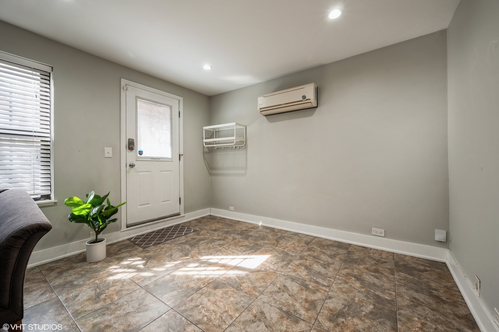 2116 West Lyndale Street, Unit 1 Chicago, IL 60647 - Photo 3 of 16 a view of a room with wooden floor and plant