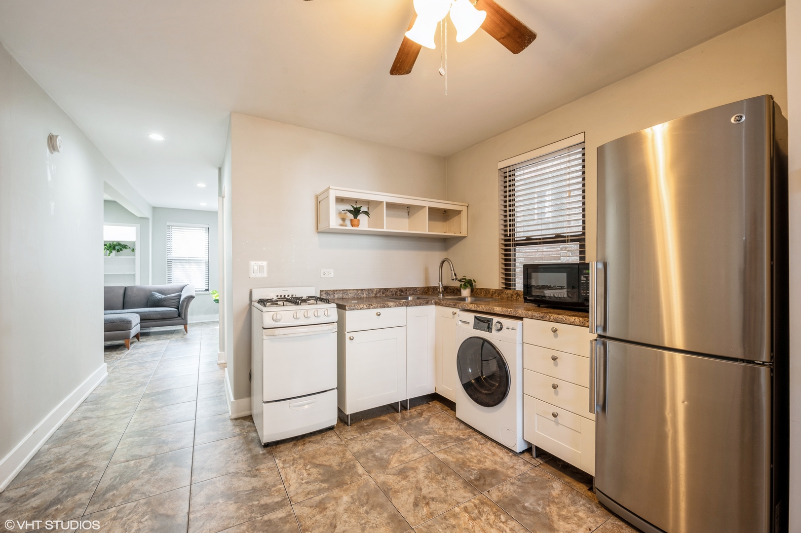 2116 West Lyndale Street, Unit 1 Chicago, IL 60647 - Photo 5 of 16 a kitchen with refrigerator and cabinets