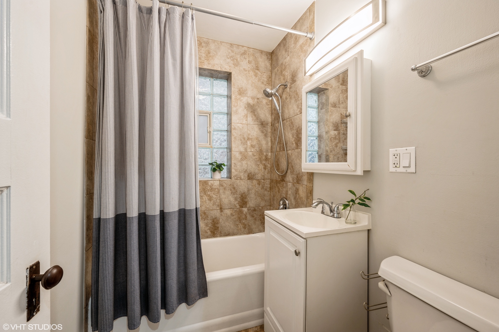 2116 West Lyndale Street, Unit 1 Chicago, IL 60647 - Photo 9 of 16 a bathroom with a sink toilet and shower