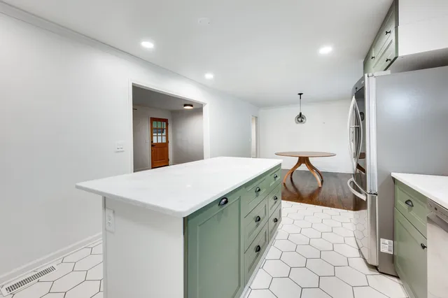 a spacious bathroom with a sink a mirror and a shower