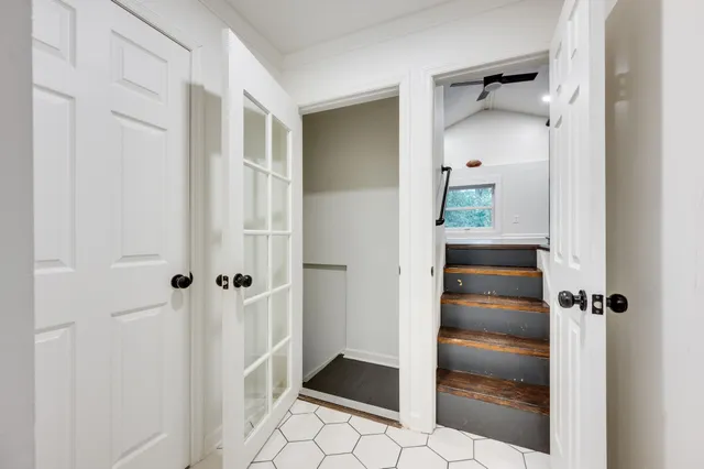 a bathroom with a glass shower door