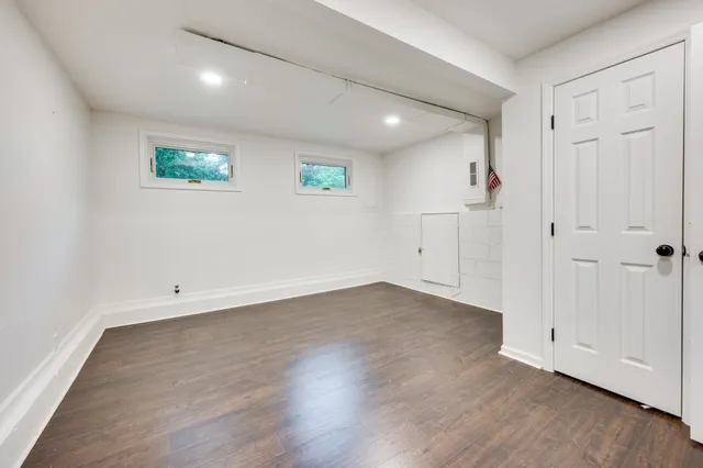 an empty room with wooden floor