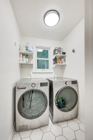 a room with furniture and washing machine
