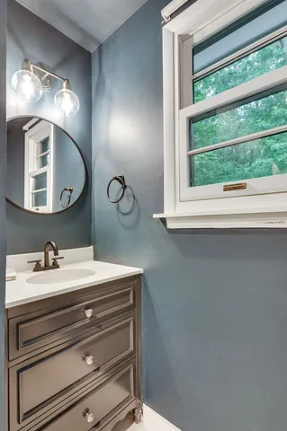 a bathroom with a sink and a mirror