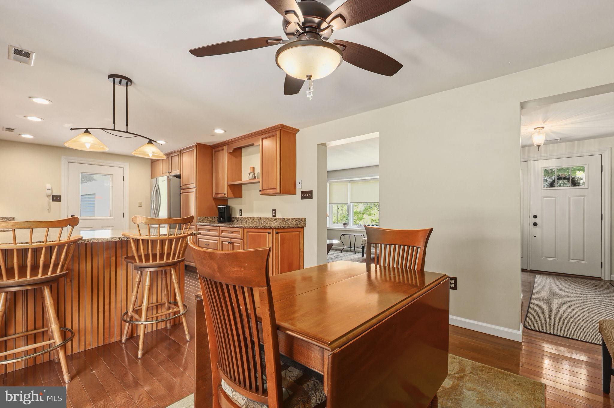 6336 Boyers Mill Road New Market, MD 21774 - Photo 8 of 49 a view of a dining room with furniture and wooden floor