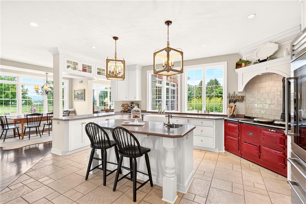 486 Settler Road Ligonier, PA 15658 - Photo 12 of 49 The AGA oven/stove is the Star of this gorgeous Kitchen. Chandeliers (2022), Sharp M/W (2022), Fisher Paykel Double Drawer Dishwasher (2022)