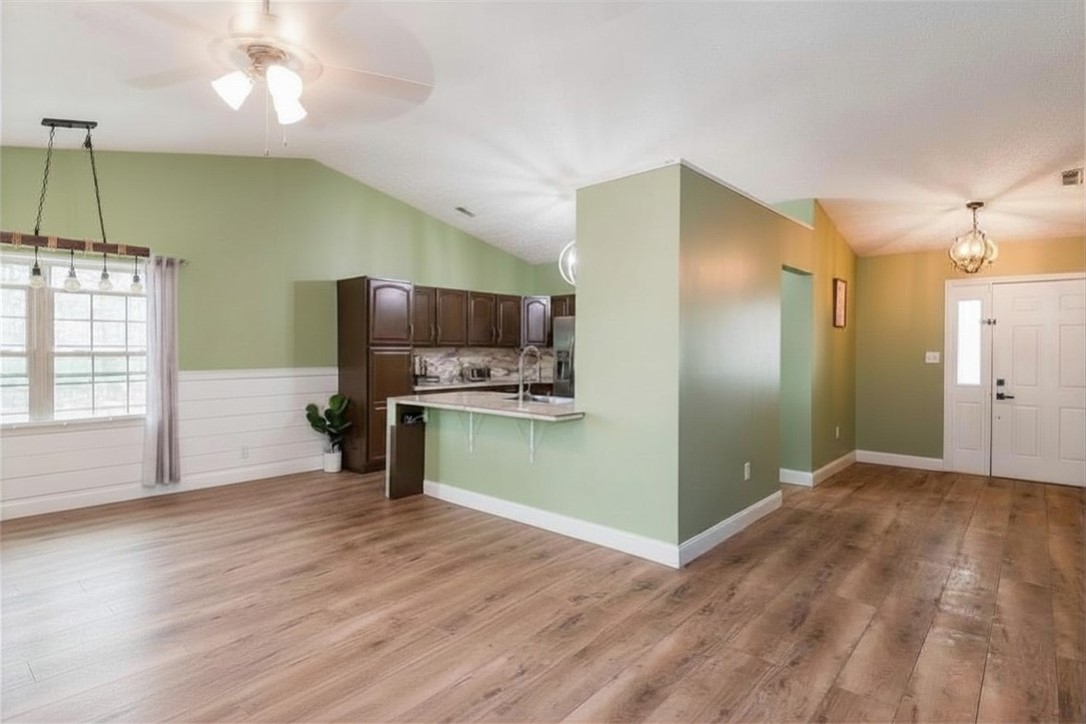 175 Marrett Farm Road Englewood, OH 45322 - Photo 12 of 29 This inviting space features an open layout connecting the kitchen and living areas, highlighted by natural light.