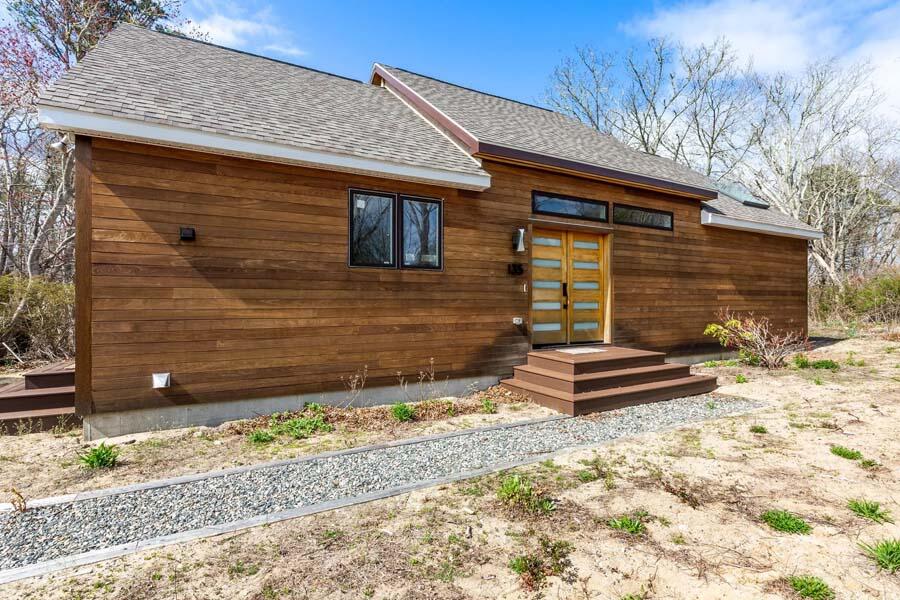 a front view of a house with a yard