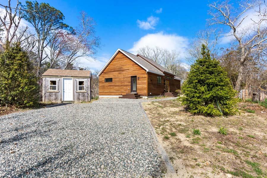 135 Old Truro Road Wellfleet, MA 02667 - Photo 13 of 38 a view of a house with a yard