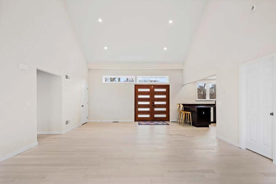 135 Old Truro Road Wellfleet, MA 02667 - Photo 16 of 38 a view of an empty room with a fireplace and a window
