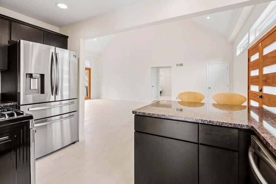 135 Old Truro Road Wellfleet, MA 02667 - Photo 18 of 38 a kitchen with granite countertop a refrigerator and a sink
