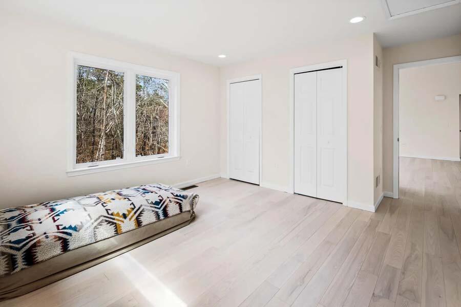 135 Old Truro Road Wellfleet, MA 02667 - Photo 19 of 38 a bedroom with a bed and a window
