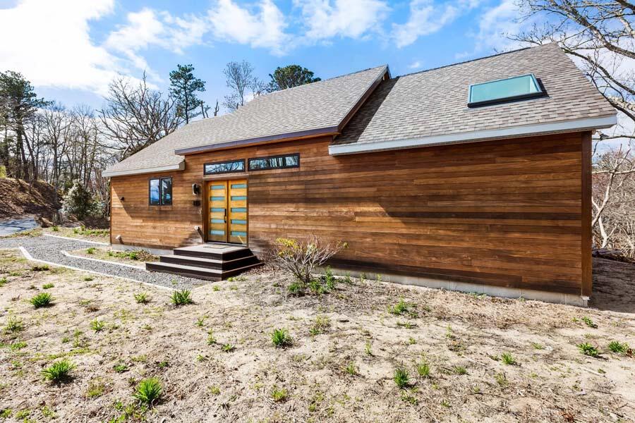 135 Old Truro Road Wellfleet, MA 02667 - Photo 2 of 38 a view of a house with a yard and wooden fence