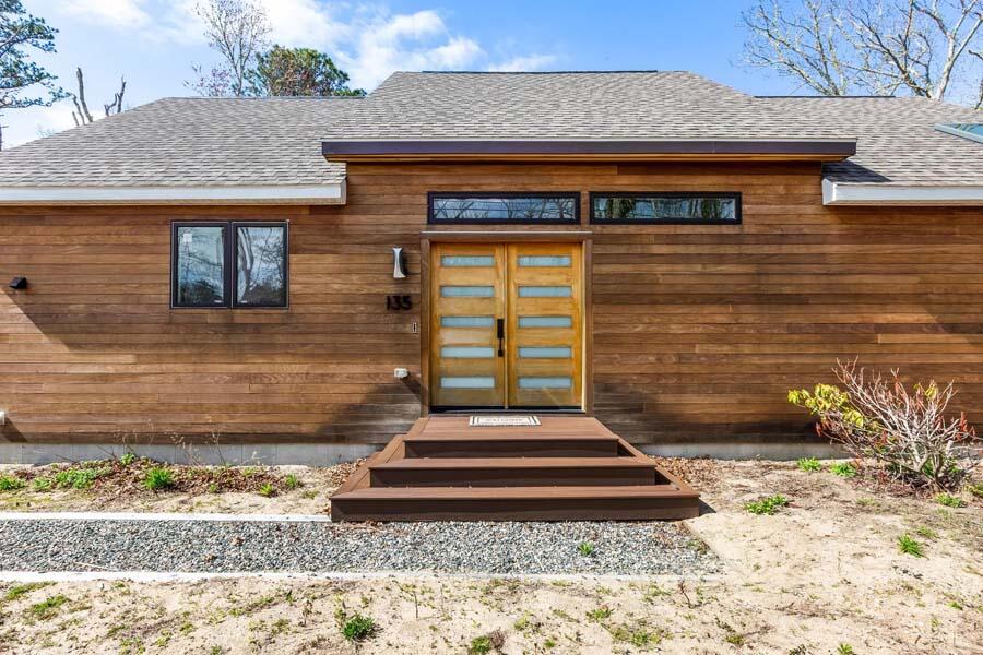 135 Old Truro Road Wellfleet, MA 02667 - Photo 3 of 38 a front view of a house with a yard