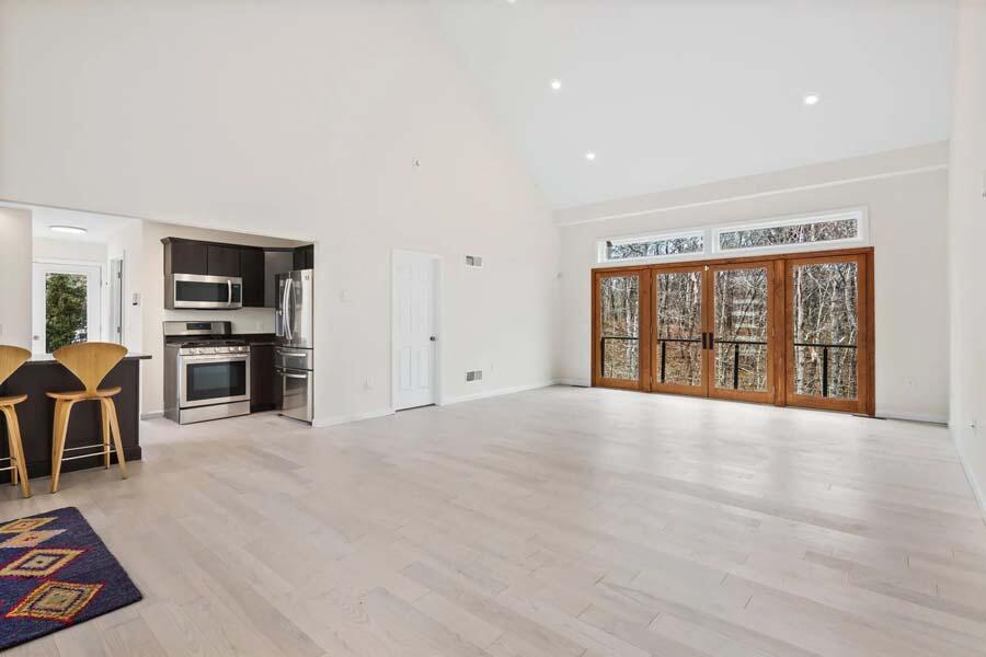 135 Old Truro Road Wellfleet, MA 02667 - Photo 6 of 38 a view of an empty room with kitchen and window