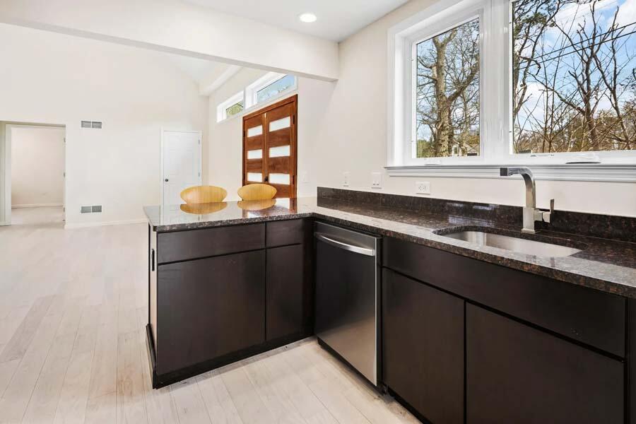 135 Old Truro Road Wellfleet, MA 02667 - Photo 8 of 38 a kitchen with granite countertop a sink and a window