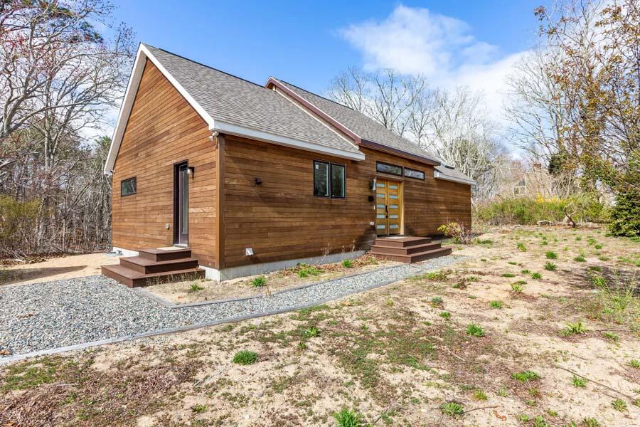 135 Old Truro Road Wellfleet, MA 02667 - Photo 10 of 38 a backyard of a house