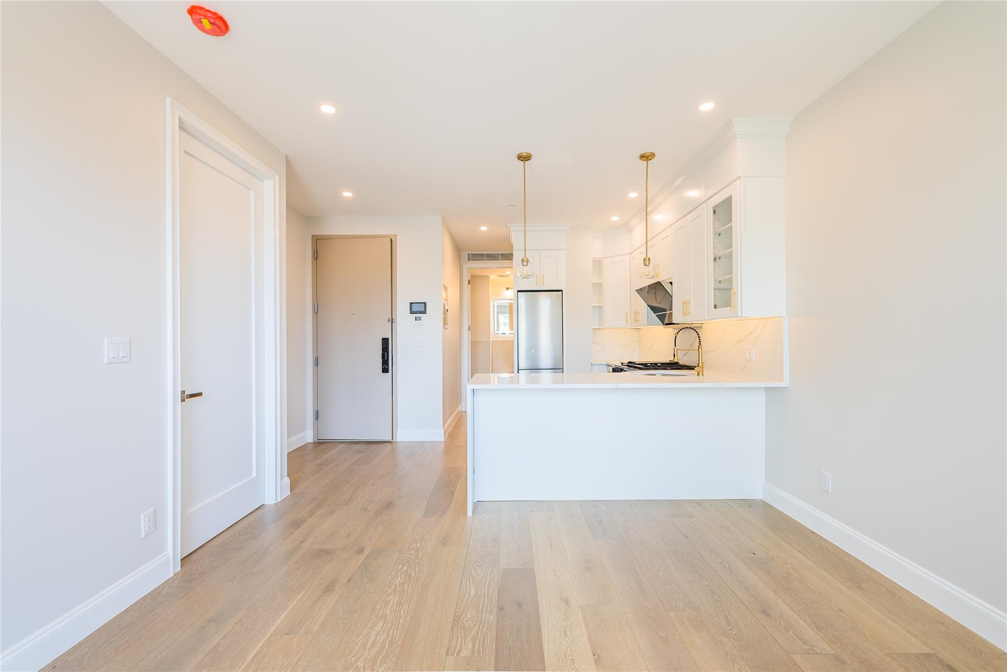 42-09 Hampton Street, Unit 4B Queens, NY 11373 - Photo 7 of 16 a view of a kitchen with wooden floor