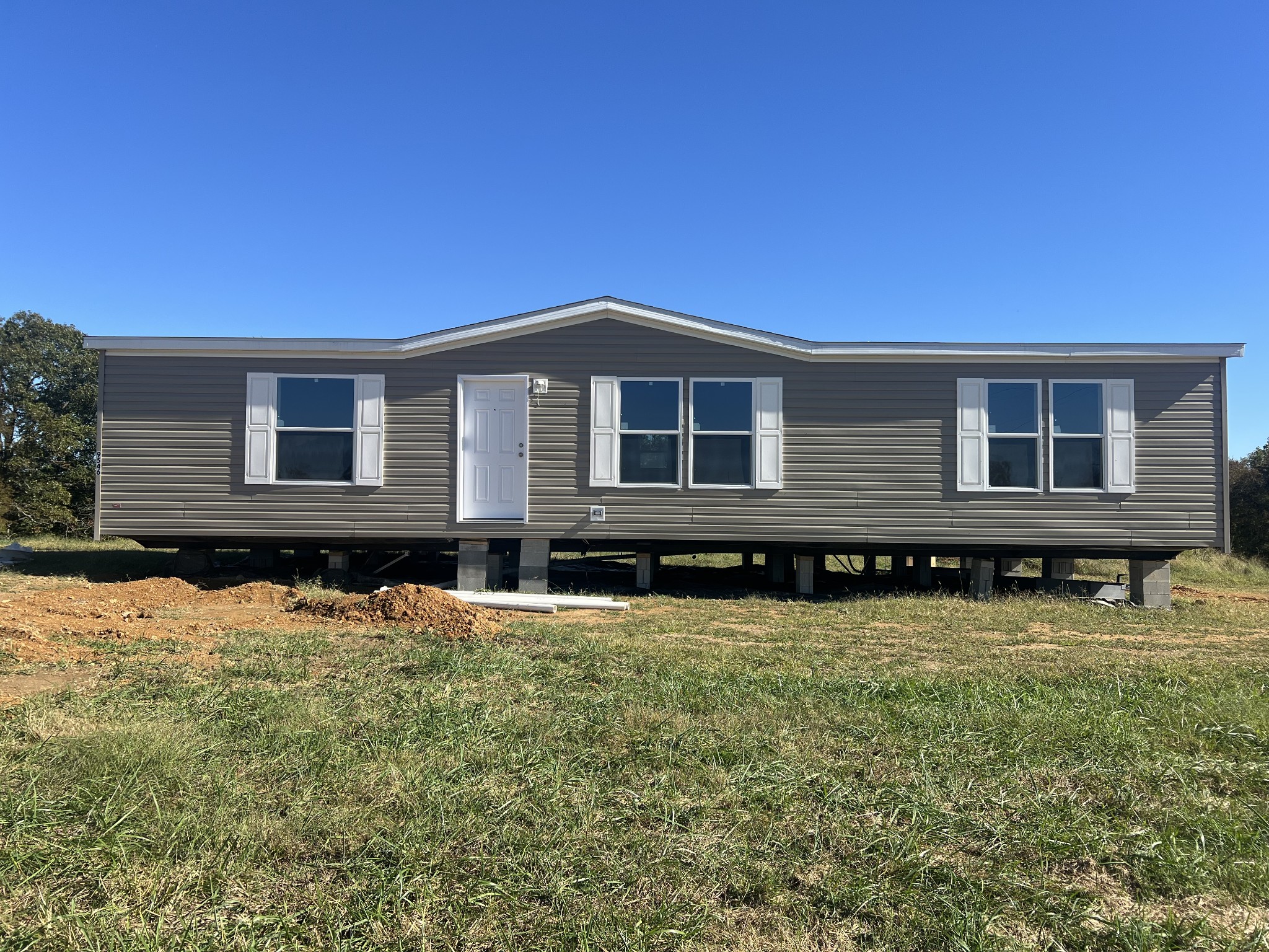 a front view of a house with yard