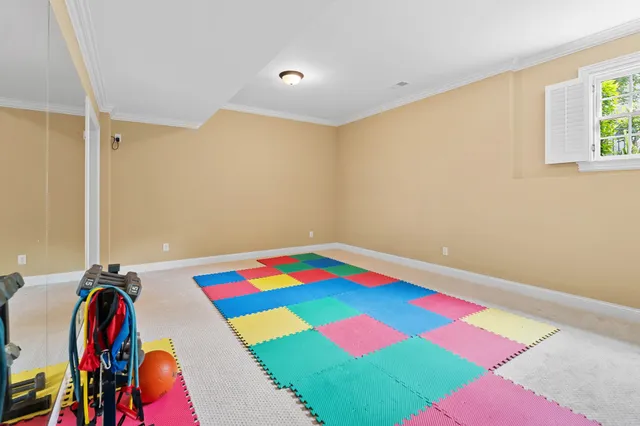 a room that has a bed and a table in it