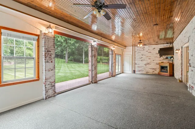 a view of an empty room with windows