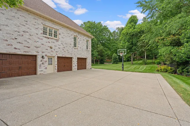 a view of a house with a yard and garage