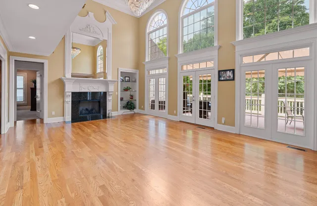 a view of an entryway with a fireplace and a window