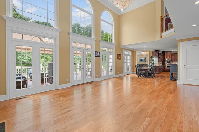 a view of a livingroom with furniture wooden floor and a window
