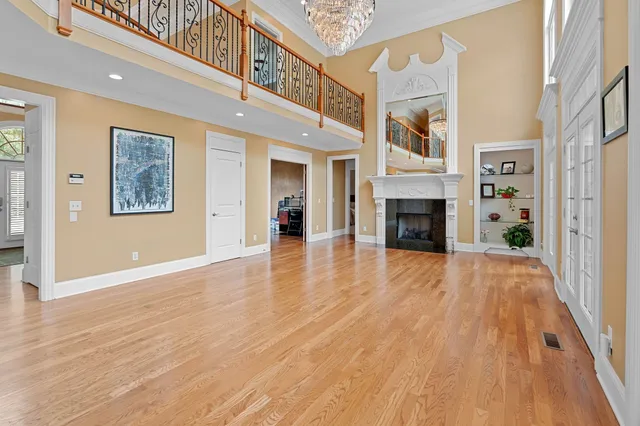 a view of an entryway with wooden floor