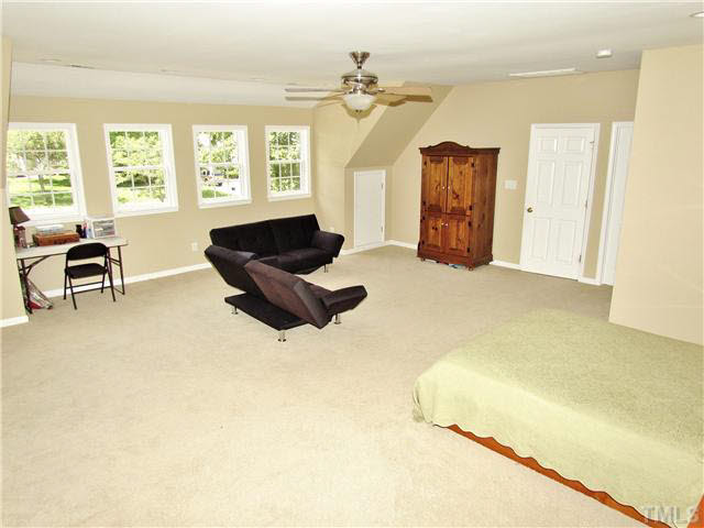 7316 Glendower Road Raleigh, NC 27613 - Photo 12 of 25 a living room with furniture and a window