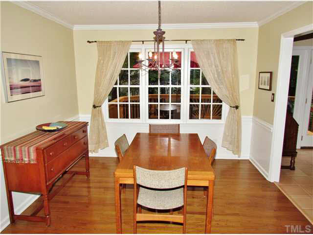 7316 Glendower Road Raleigh, NC 27613 - Photo 4 of 25 a living room with furniture and a window