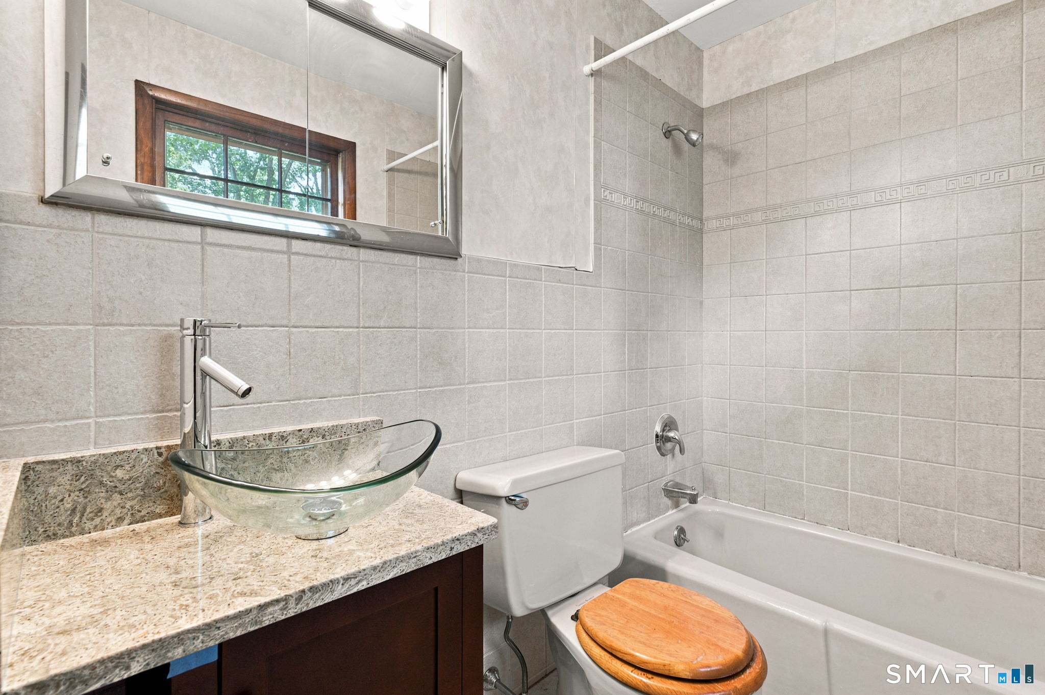448 Mixville Road Cheshire, CT 06410 - Photo 16 of 32 a bathroom with a granite countertop toilet sink and mirror