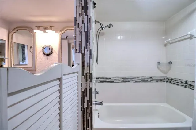 a bathroom with a bathtub and a shower