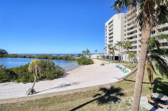 a view of a swimming pool with an outdoor space and seating area