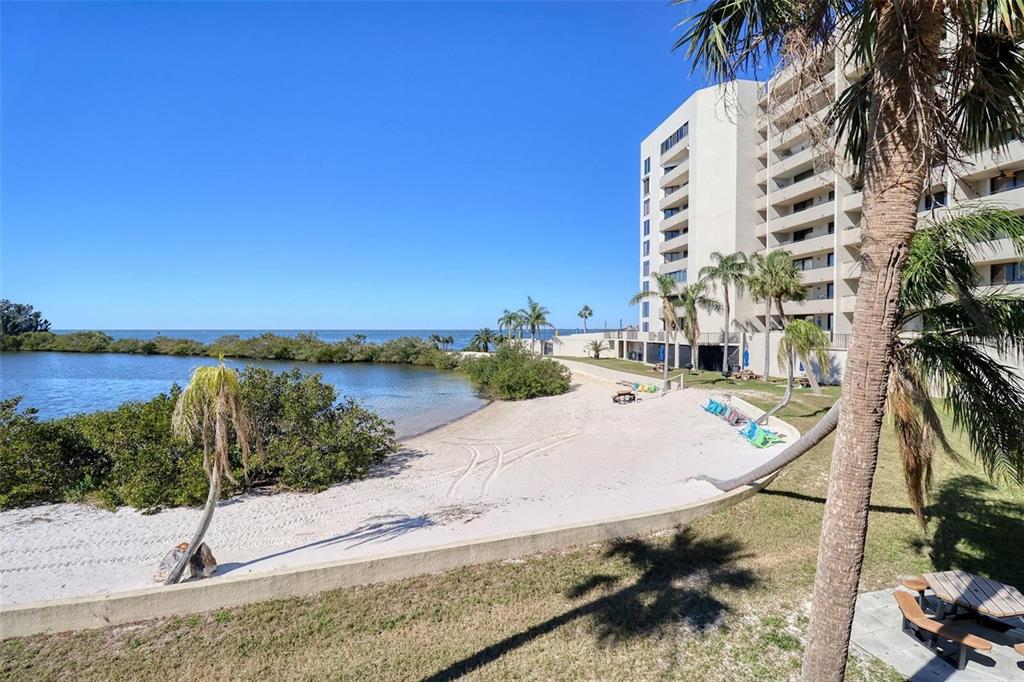 5915 Sea Ranch Drive, Unit 211 Hudson, FL 34667 - Photo 16 of 26 a view of a swimming pool with an outdoor space and seating area