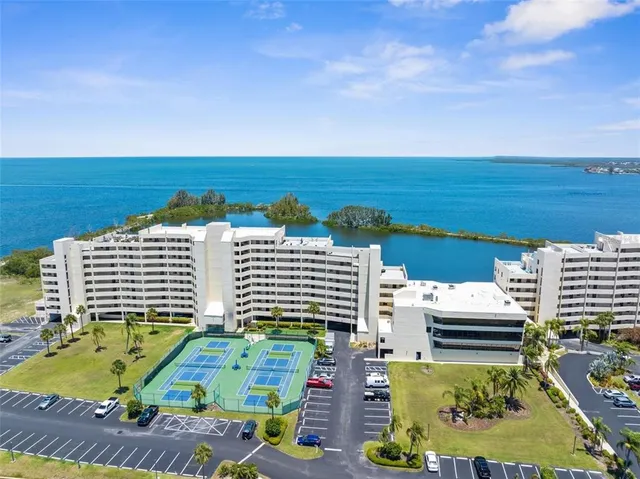 a view of swimming pool with outdoor seating and city view
