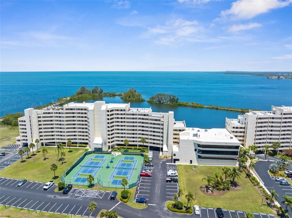 5915 Sea Ranch Drive, Unit 211 Hudson, FL 34667 - Photo 5 of 26 a view of swimming pool with outdoor seating and city view