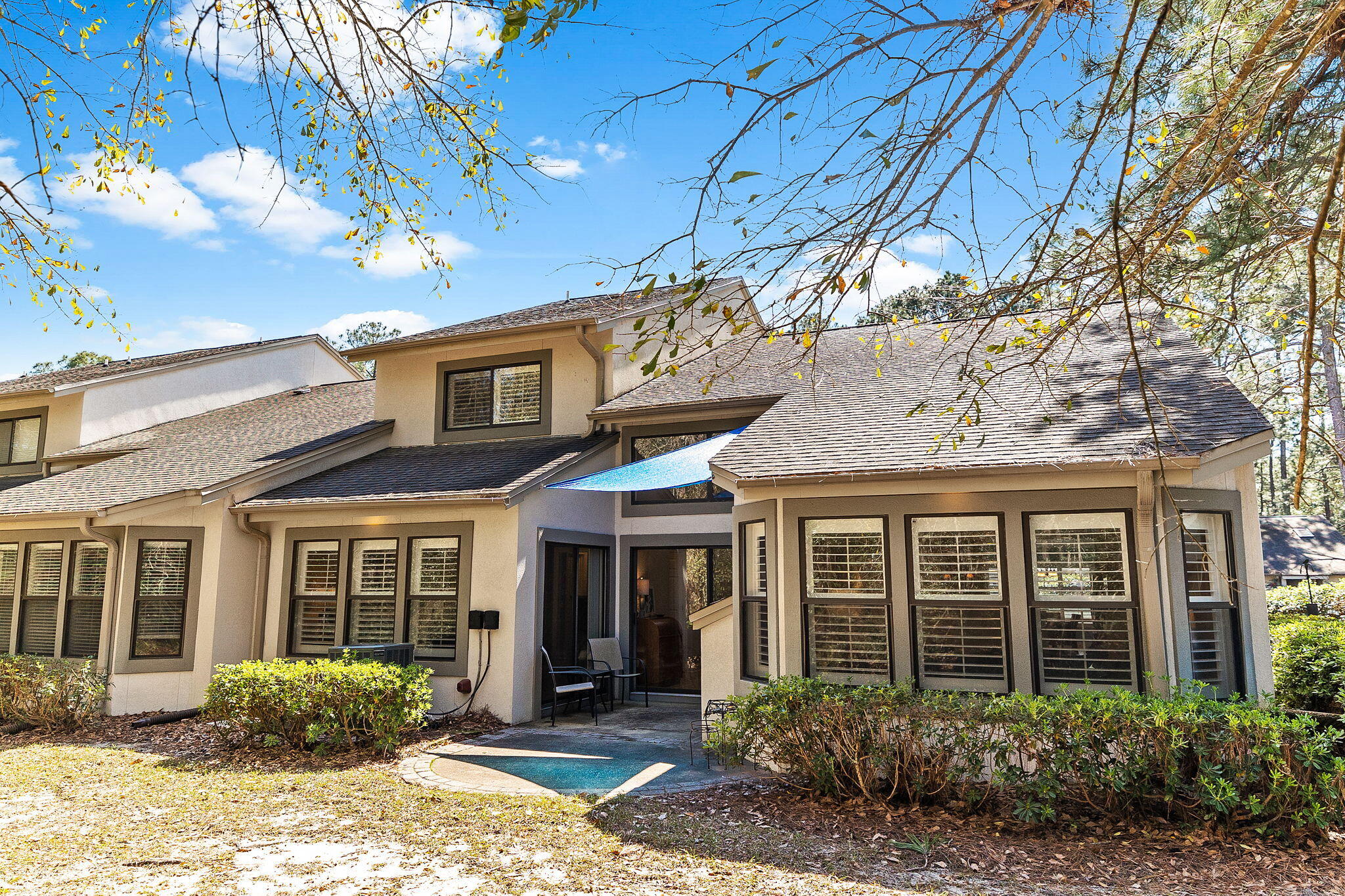 100 Gleneagles Drive Niceville, FL 32578 - Photo 20 of 60 a view of a brick house with many windows
