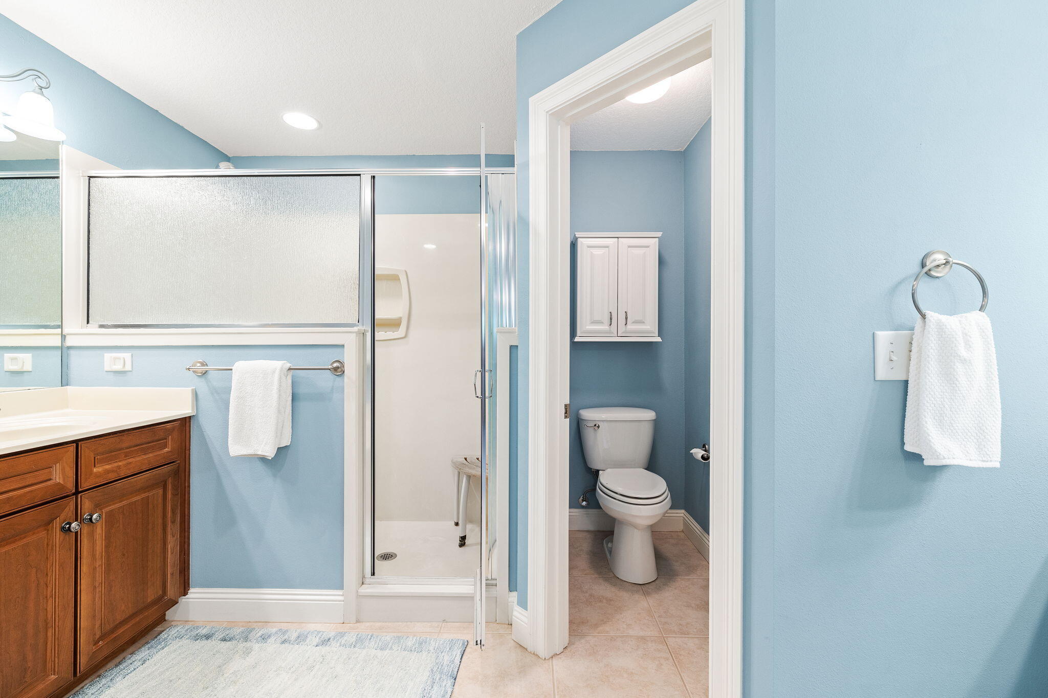 100 Gleneagles Drive Niceville, FL 32578 - Photo 25 of 60 a bathroom with a granite countertop sink a toilet and shower