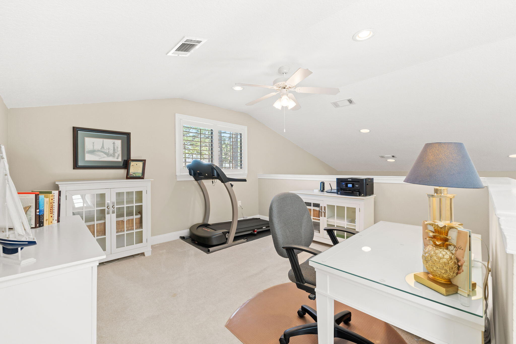 100 Gleneagles Drive Niceville, FL 32578 - Photo 32 of 60 a view of a workspace with furniture and a flat screen tv