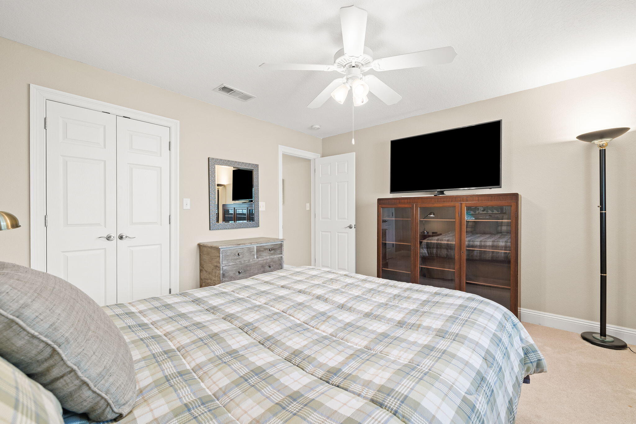 100 Gleneagles Drive Niceville, FL 32578 - Photo 35 of 60 a bedroom with a bed and a flat screen tv