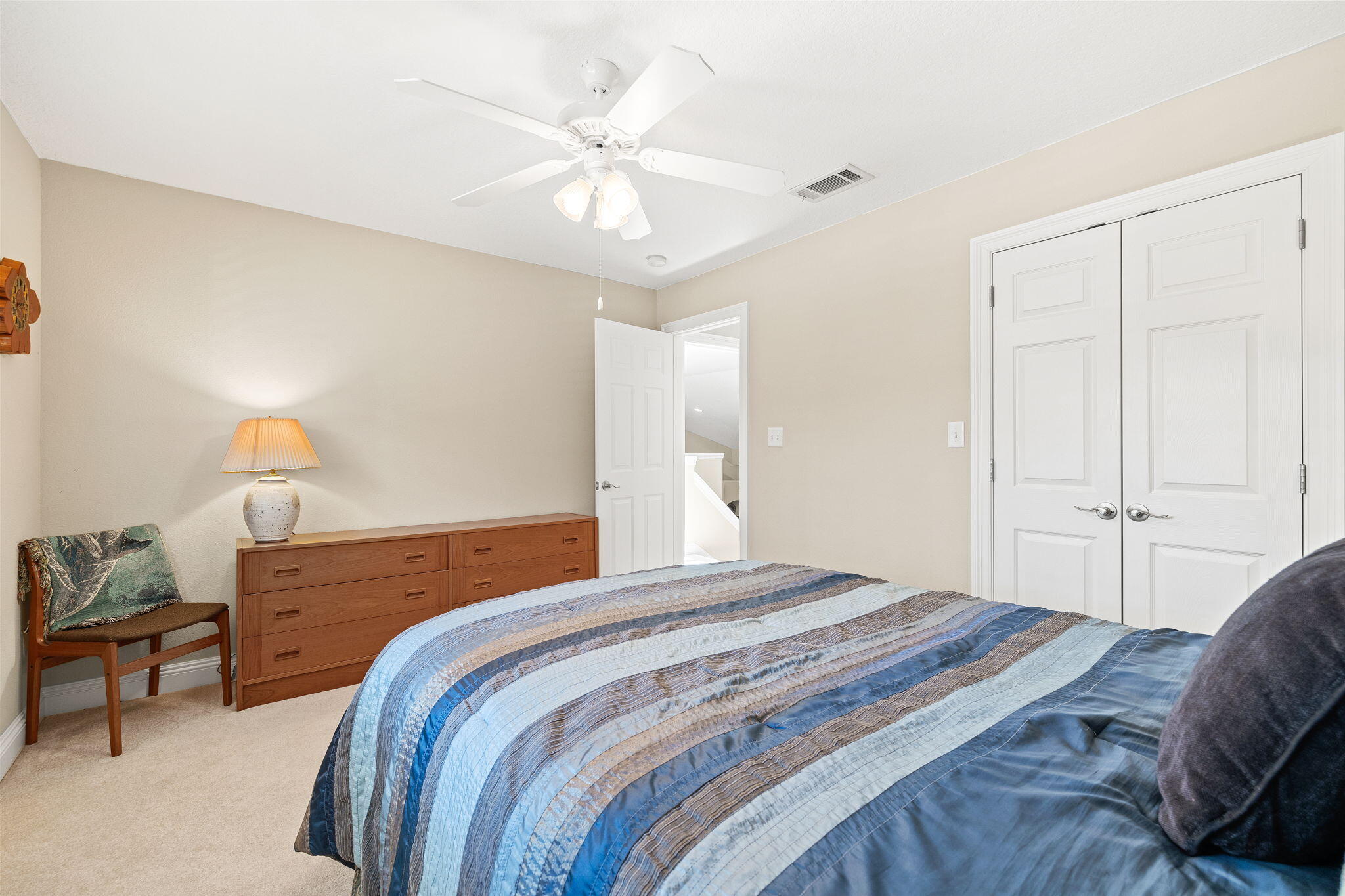 100 Gleneagles Drive Niceville, FL 32578 - Photo 39 of 60 a bedroom with a bed and a chandelier
