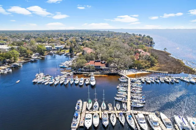an aerial view of multiple houses with a yard