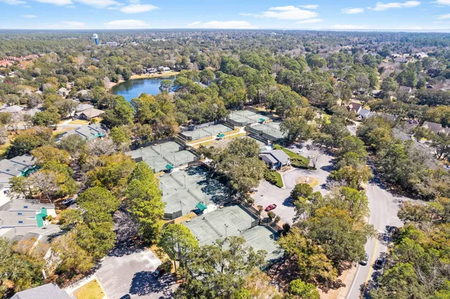 a living room with fireplace furniture and a large window