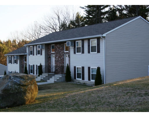 930 Templeton Road, Unit 5 Athol, MA 01331 - Photo 1 of 1 a view of a yard in front of a brick house with large windows