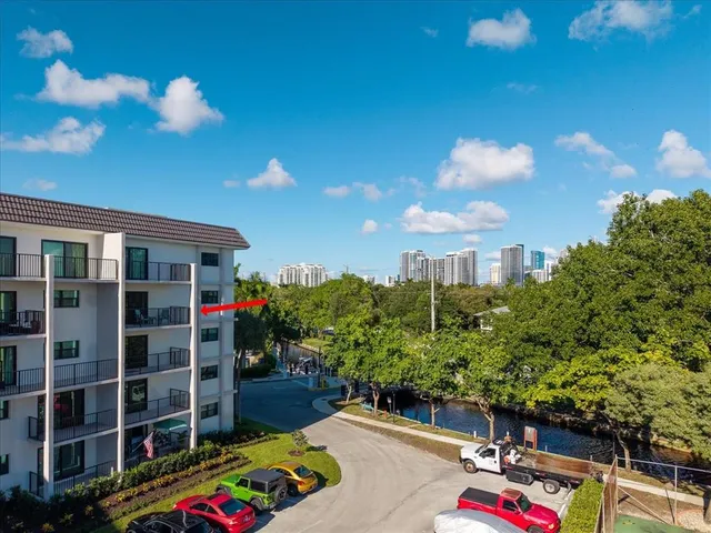 a view of a city from a corridor