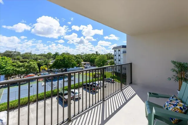 a view of balcony with wooden floor