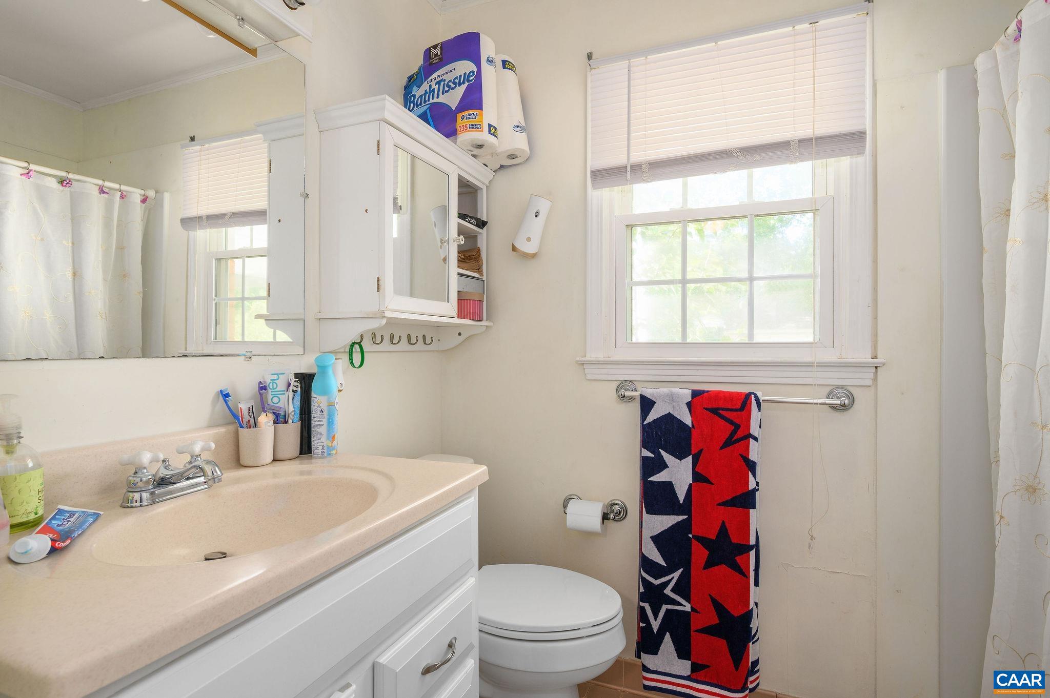 2806 Brookmere Road Charlottesville, VA 22901 - Photo 12 of 19 a bathroom with a sink toilet vanity and tub