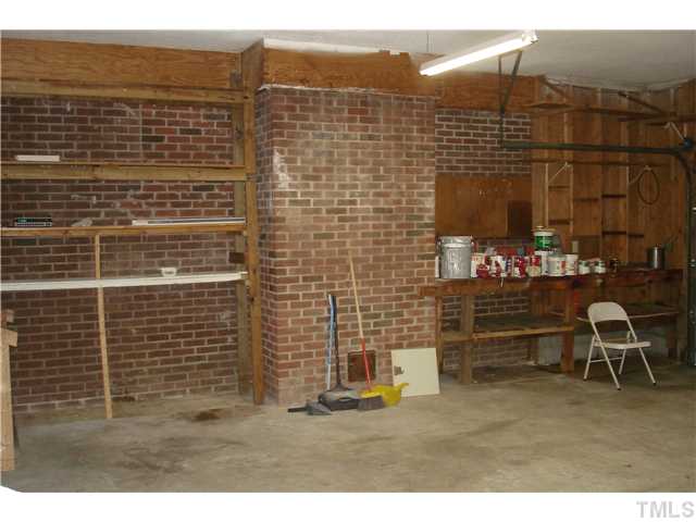 811 Springview Trail Garner, NC 27529 - Photo 11 of 13 Shelving and work bench